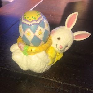 Ceramic Easter bunny holding a decorative egg